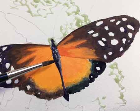Painting the butterfly first. When painting a portrait, I like to paint the subject first.